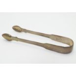 George III silver fiddle pattern sugar tongs. Hallmarked London 1810 maker WE. 5 1/2" long Please