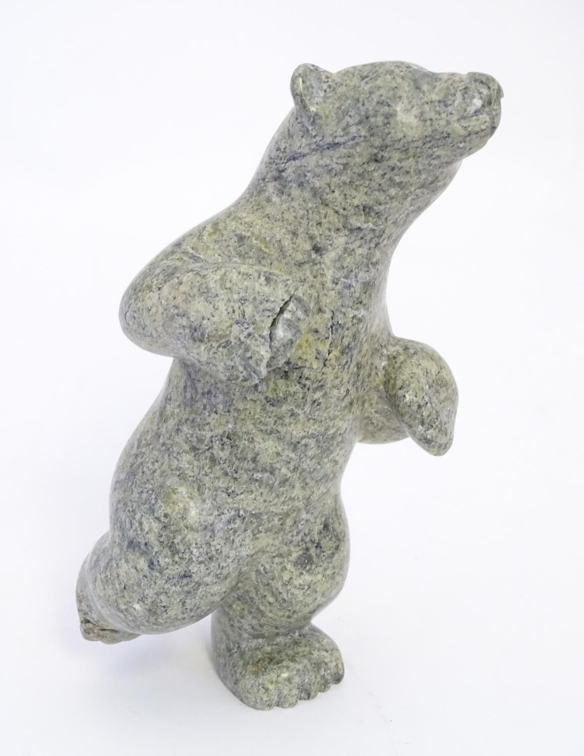 A 20thC Inuit serpentine carving depicting a dancing bear by Markosie Papigatok (b. 1976) (Cape