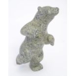 A 20thC Inuit serpentine carving depicting a dancing bear by Markosie Papigatok (b. 1976) (Cape