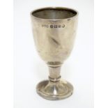 A silver egg cup of pedestal form hallmarked Birmingham 1934 with silver jubilee mark maker Deykin &