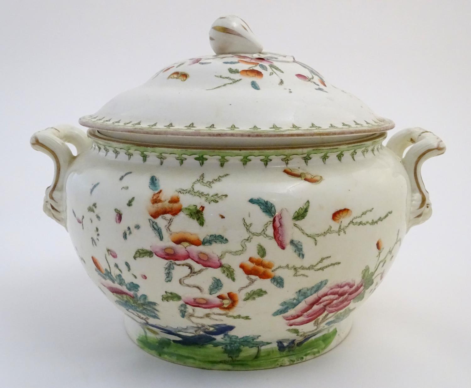 A Chinese tureen and cover with twin handles decorated with a stylised landscape with a tree and - Image 5 of 10