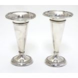 Two silver bud vases hallmarked Birmingham 1912 and 1915. The tallest 4 1/2" high Please Note - we