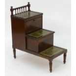 A 19thC mahogany step commode /set of library steps with three gold tooled leather tiers and a
