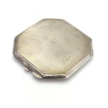 An Art Deco silver compact of square/octagonal form with engine turned decoration. Hallmarked