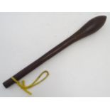 Ethnographic / Native / Tribal: A hardwood tribal club with a pointed, ovoid head and carved
