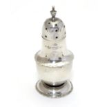A silver pepperette hallmarked Chester 1903 maker E J Trevitt & Sons Ltd 2 3/" high Please Note - we