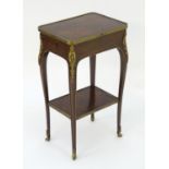 A 19thC mahogany table with ormolu banding and mounts above a single short drawer, cabriole legs and
