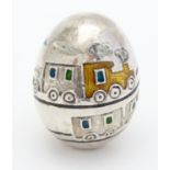 A silver plate and enamel novelty egg with enamel train design, Italian collectable, signed under