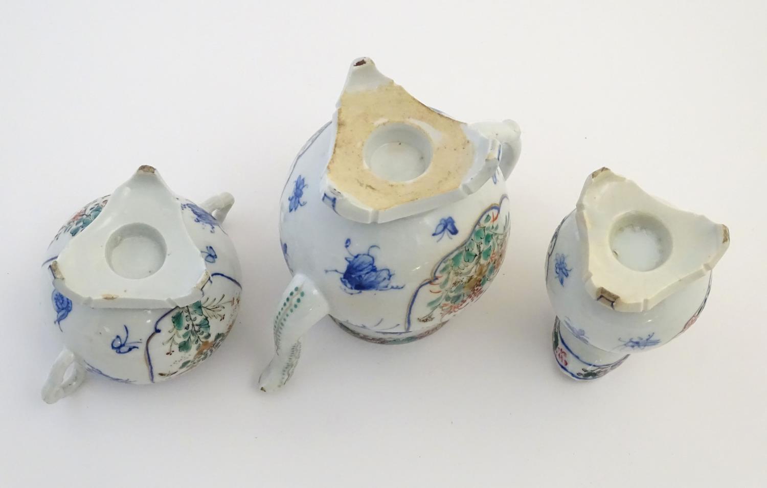 A Japanese teapot, twin handled sugar bowl and milk jug decorated with hand painted insects and - Image 2 of 8