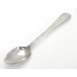 A silver old English pattern tea spoon with bright cut decoration. London 1787 maker Hester Bateman.