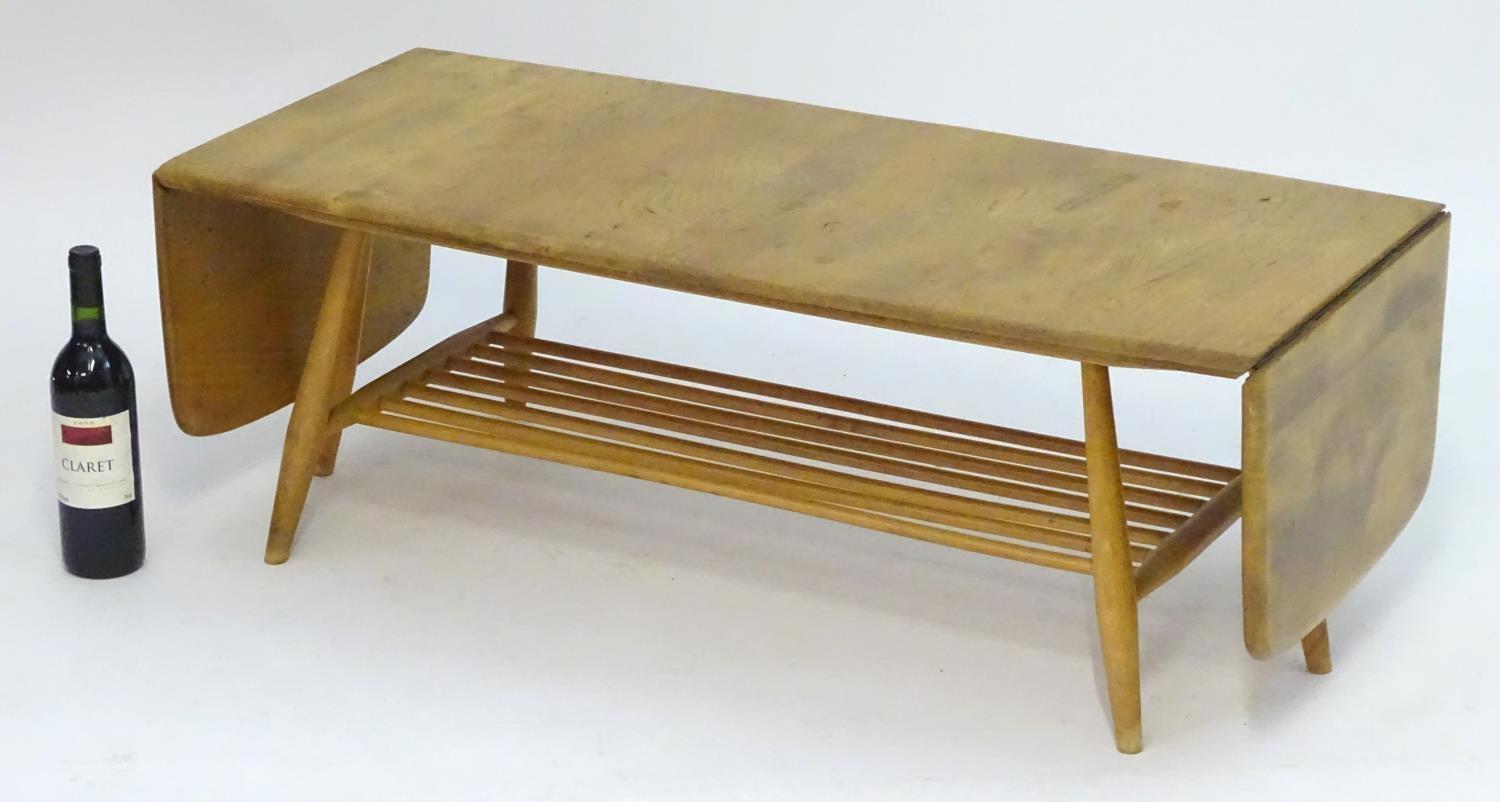 Vintage Retro, Mid-Century: an Ercol elm and beech coffee table, extending with drop flaps, standing - Image 2 of 7