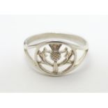 A silver signet ring with Scottish thistle decoration. Ring size approx L Please Note - we do not