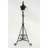 Lighting: a late-Victorian wrought iron standard lamp (converted to electricity) with black