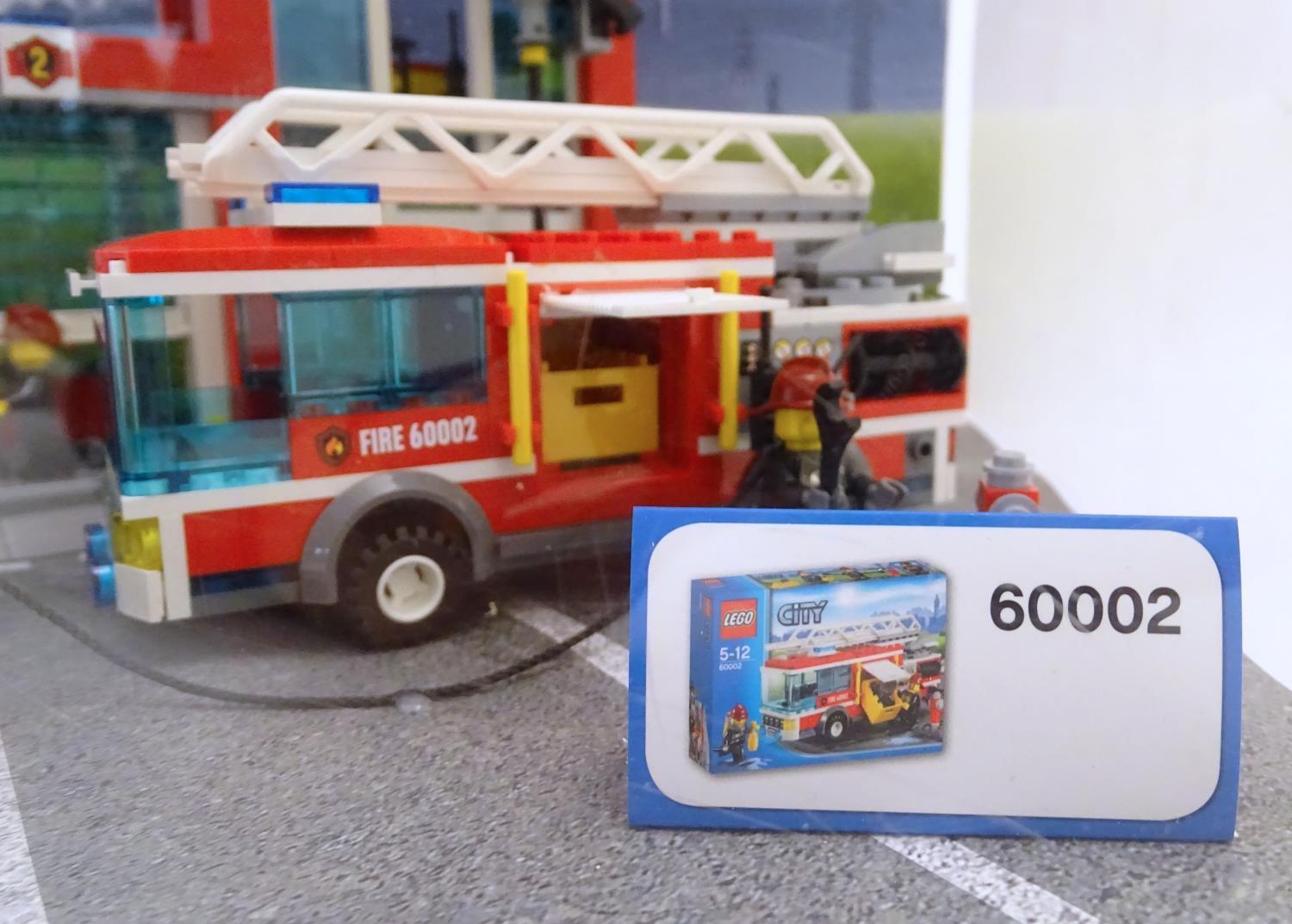 Toy: A Lego City shop display unit featuring a fire station, model no. 60004 and a fire truck, model - Image 7 of 11