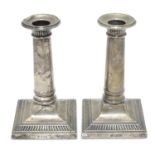 A pair of silver candlesticks hallmarked Sheffield 1917 maker Thomas Bradbury & Sons Ltd. 5" high