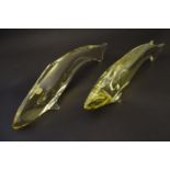 Two studio yellow glass fish ornaments by Bohemia Glass, Czechoslovakia, each labelled, 12 5/8" & 11