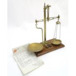 A set of c1900 beam balance scales by W & T Avery Ltd, Birmingham. With assorted weights and