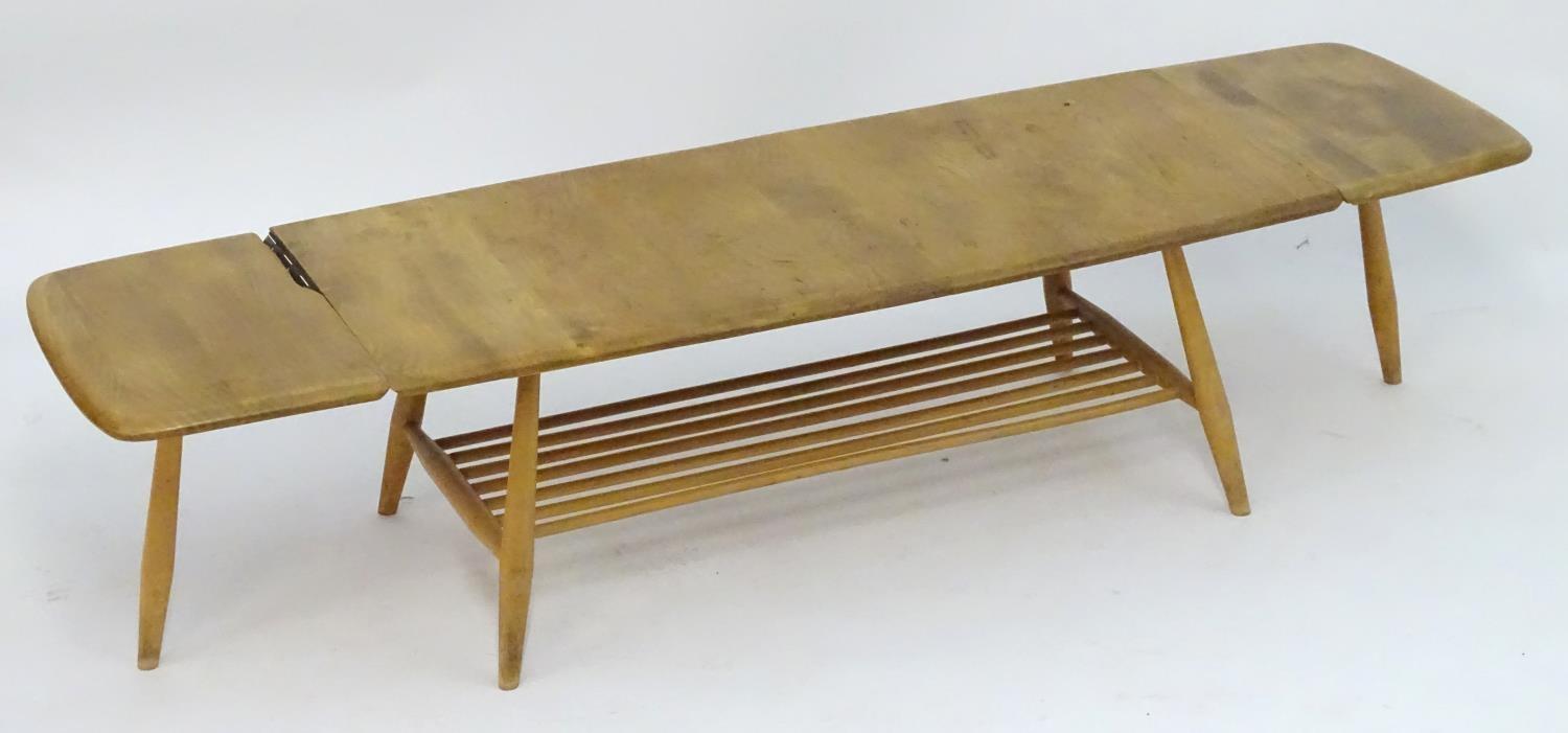 Vintage Retro, Mid-Century: an Ercol elm and beech coffee table, extending with drop flaps, standing - Image 4 of 7