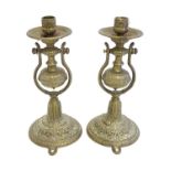 A pair of 19thC brass gimbal mounted candlesticks with foliate decoration, with bracket to base