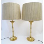 A pair of 20thC brass table lamps, of sectional vegetal form. 33 1/2" tall (including cloth