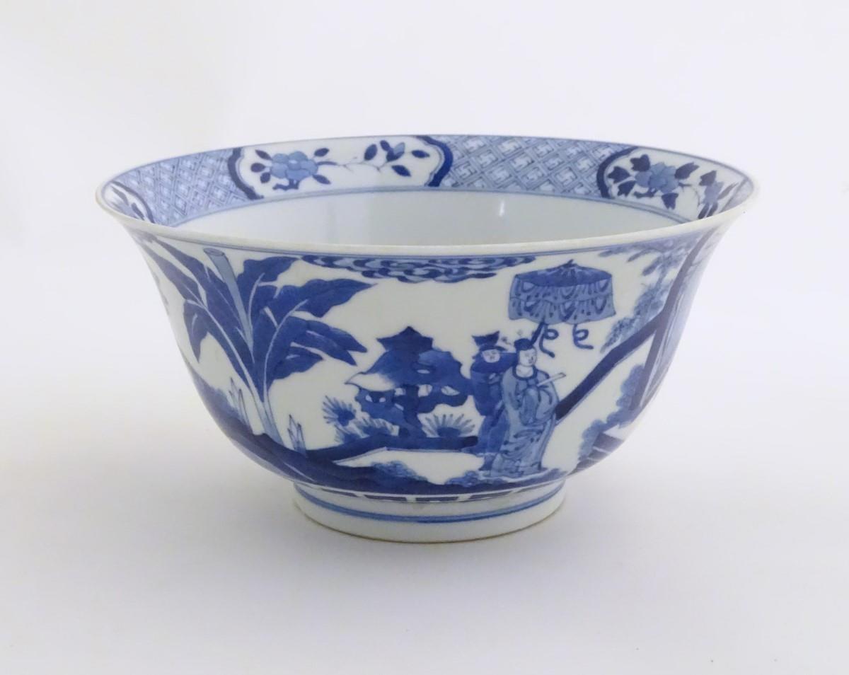 A Chinese blue and white footed bowl with a flared rim, decorated with a scene depicting the - Image 2 of 7