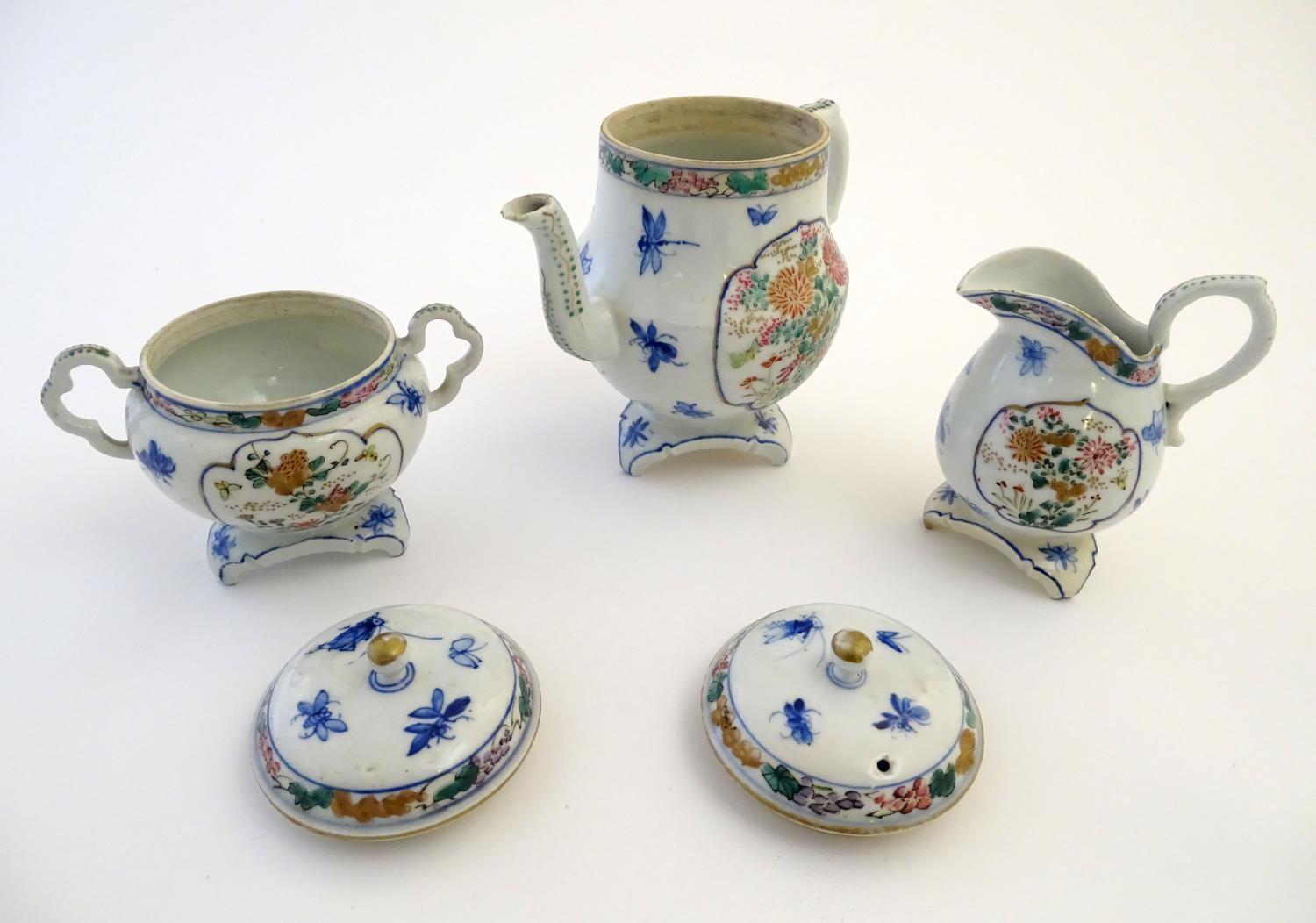 A Japanese teapot, twin handled sugar bowl and milk jug decorated with hand painted insects and - Image 4 of 8