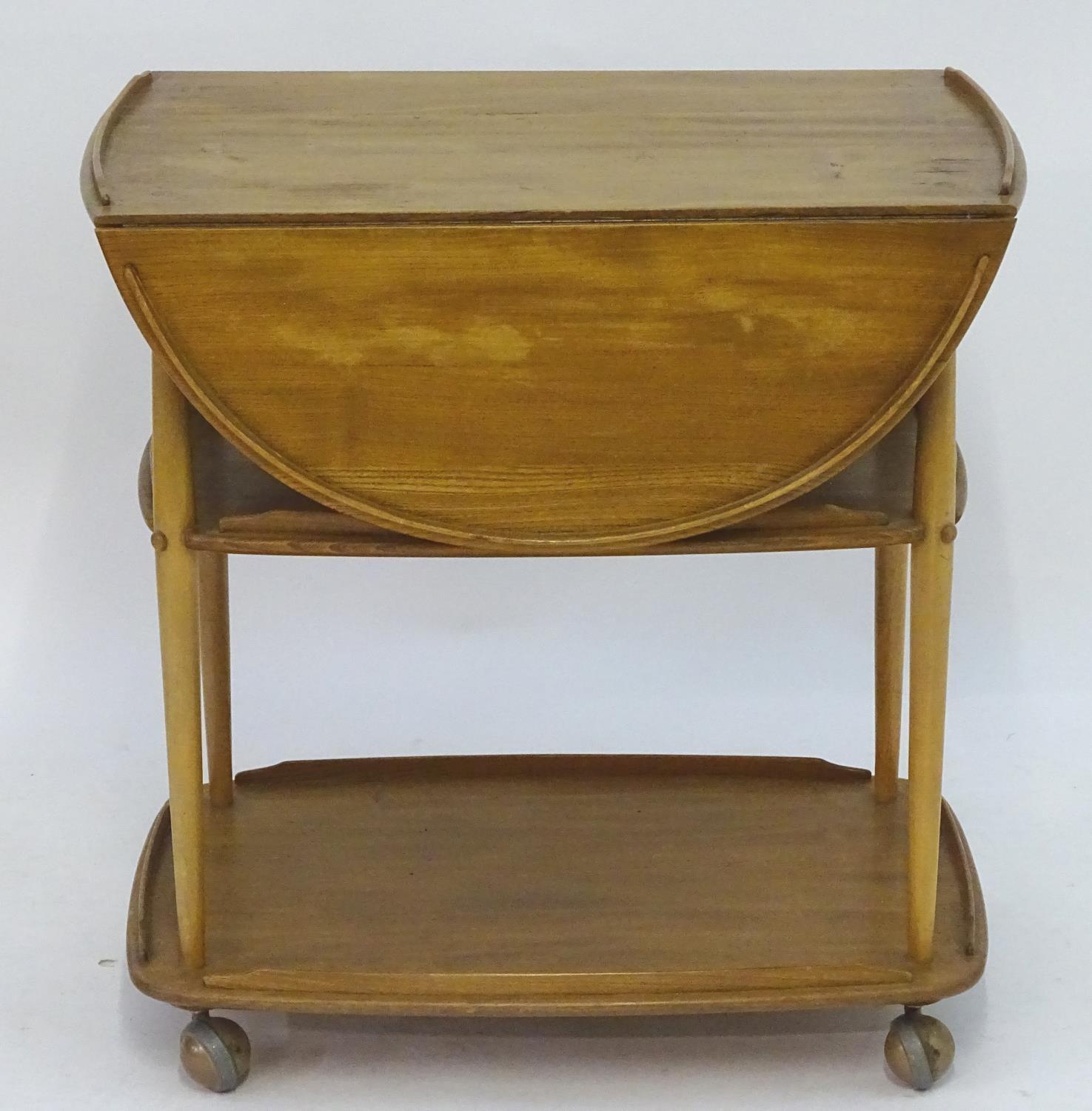 Vintage Retro, Mid-Century: an Ercol elm and beech three tiered trolley, the top with drop flaps, - Image 3 of 5