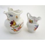 Two 19thC jugs with relief floral decoration and hand painted flowers. Tallest approx. 6 3/4"