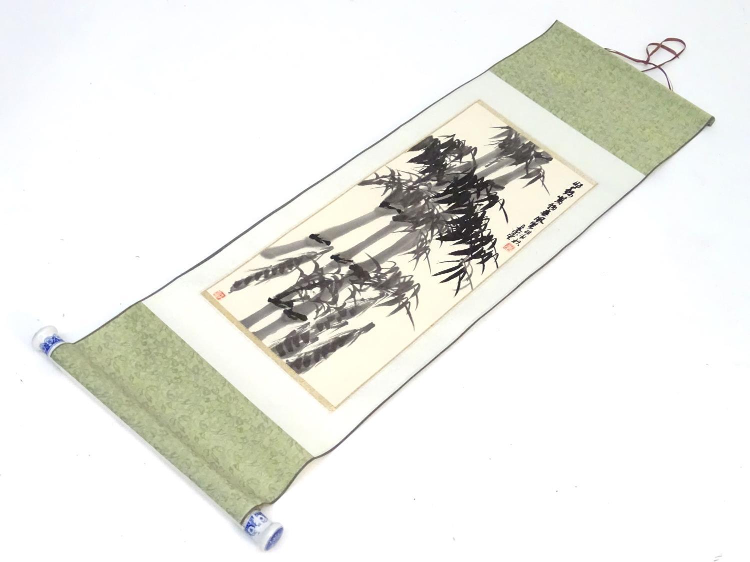 A Japanese watercolour scroll depicting bamboo, with character marks upper right and seal stamp