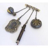 A 19thC gilt metal chatelaine brooch comprising a miniature notepad, a scent bottle formed as a