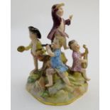 A 19thC Meissen porcelain figure group depicting five putti / children playing musical instruments