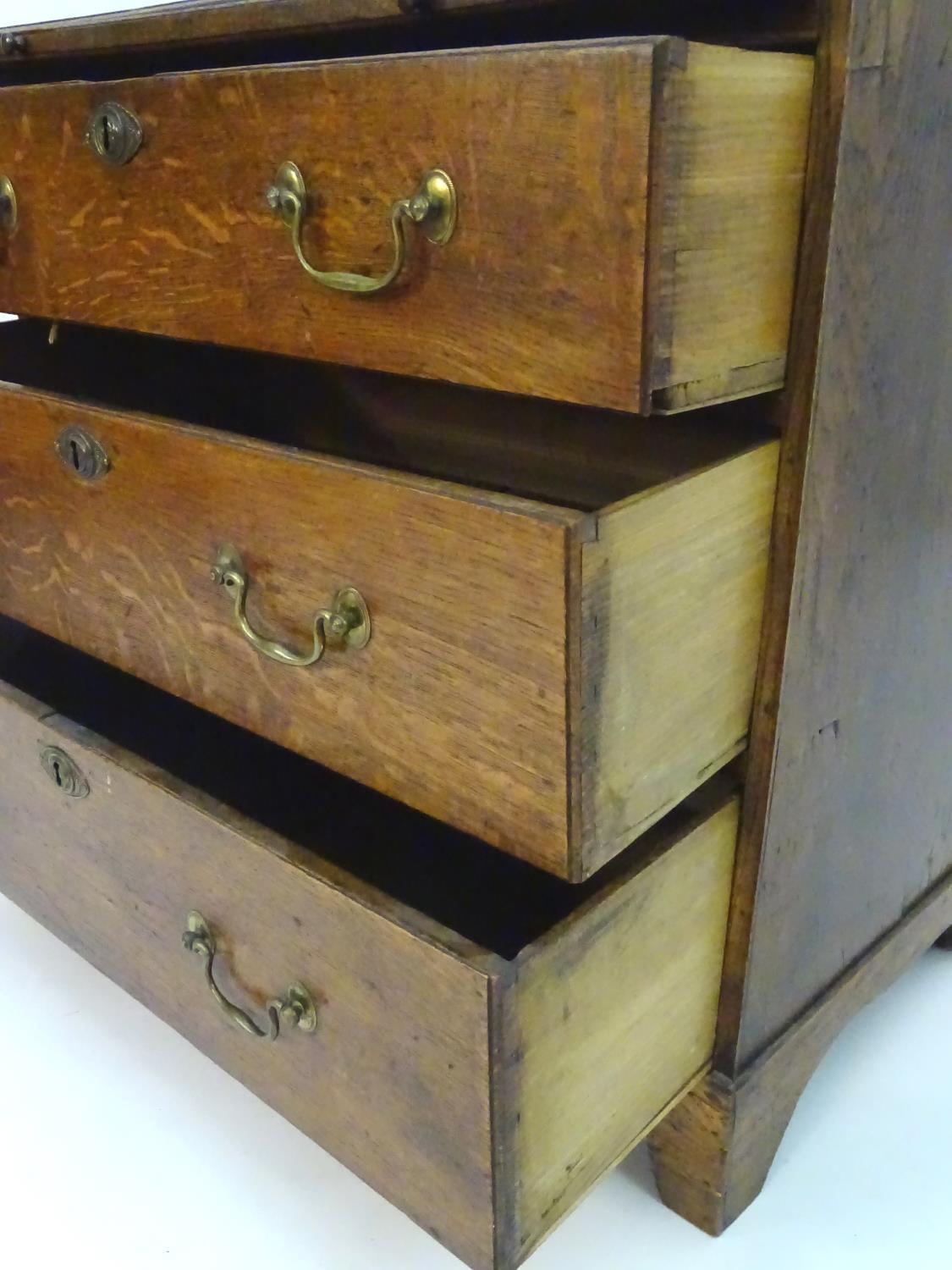 A mid 18thC oak chest of drawers with a rectangular top above a brushing slide and three long - Image 6 of 7