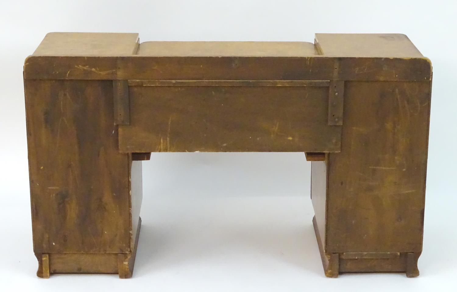 A mid 20thC burr walnut dressing table with two short drawers flanked by cupboards to each side. 48" - Image 7 of 7