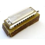 Musical Instrument: a boxed mid-20thC 'Chromonica' harmonica mouth organ by M. Hohner, Germany.