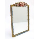 A 20thC Barbola wall mirror of rectangular form surmounted by a moulded floral crest, the side