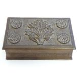 A 20thC Kashmiri walnut wood puzzle box with carved floral and foliate decoration and a sliding