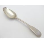A Georgian Irish silver fiddle pattern dessert spoon with rat tail bowl. Hallmarked Dublin 1807