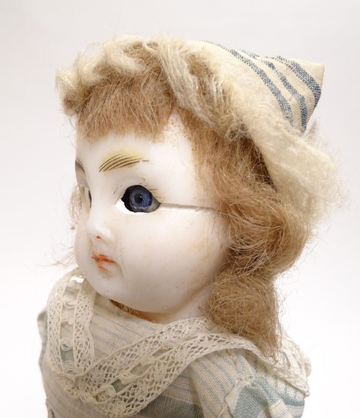 Toy: A wax headed doll with blue eyes, painted features, brown hair, composite forearms and - Image 8 of 9