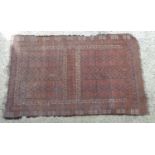 Caret / rug : A hand made red ground rug with blue white and brown detail. Approx 81" x 51" Please