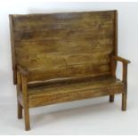 A late 17thC / early 18thC elm monks bench of peg jointed construction. 62" long x 36" wide x 32"