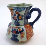 A Victoria Ware ironstone octagonal jug decorated in the Imari palette with floral and bird