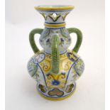 A Continental faience double gourd vase with three loop handles, reticulated openwork to rim and