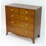 An early / mid 19thC mahogany chest of drawers comprising two short over three long drawers with