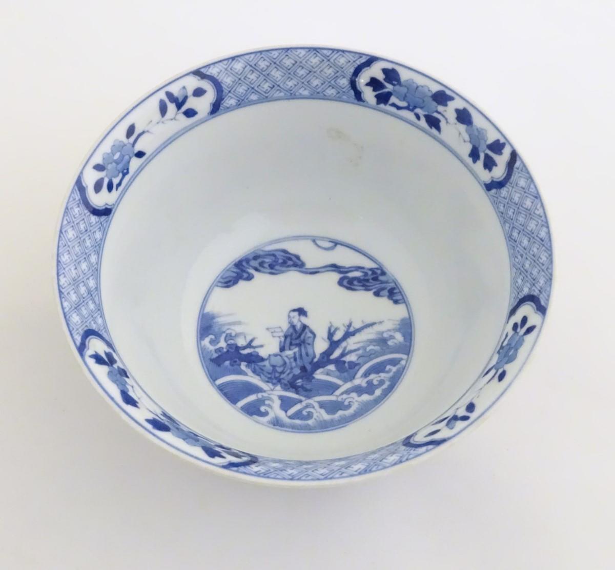 A Chinese blue and white footed bowl with a flared rim, decorated with a scene depicting the - Image 4 of 7