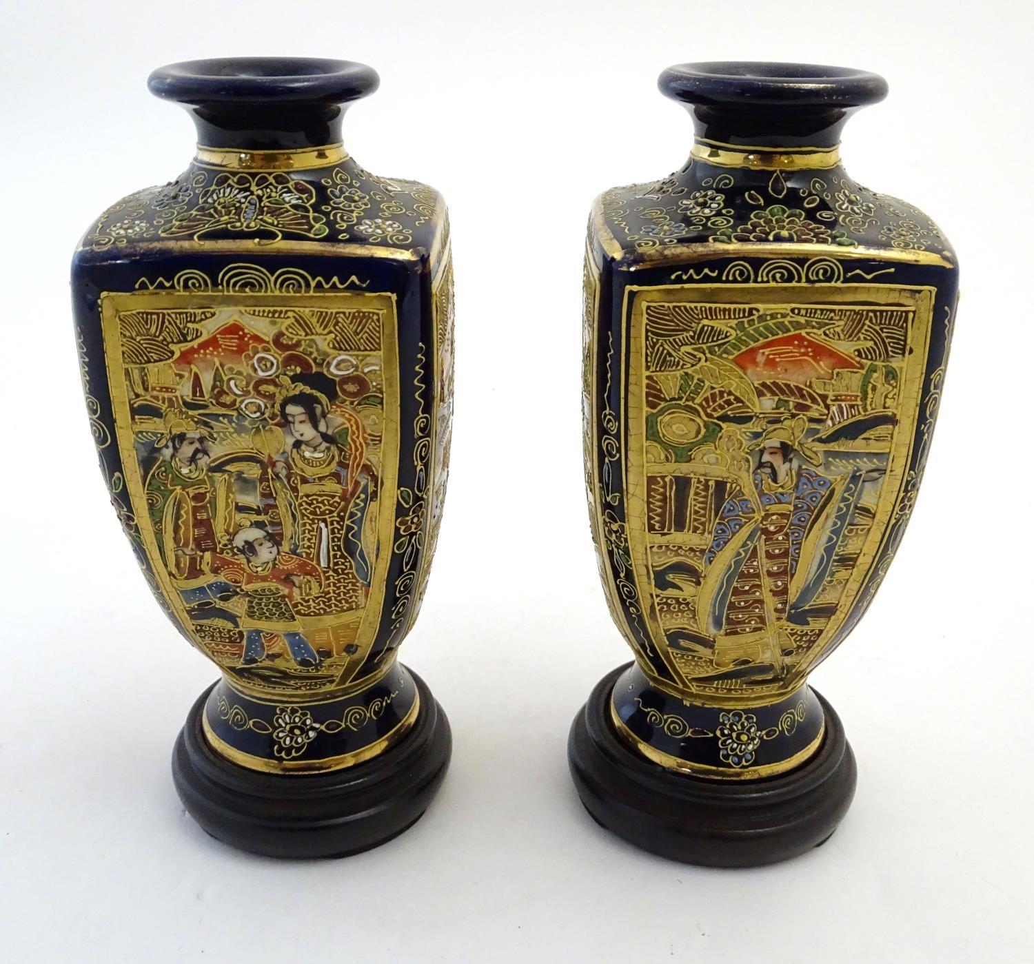 A pair of Japanese Satsuma vases of square baluster form with a cobalt blue ground, with panelled - Image 3 of 8