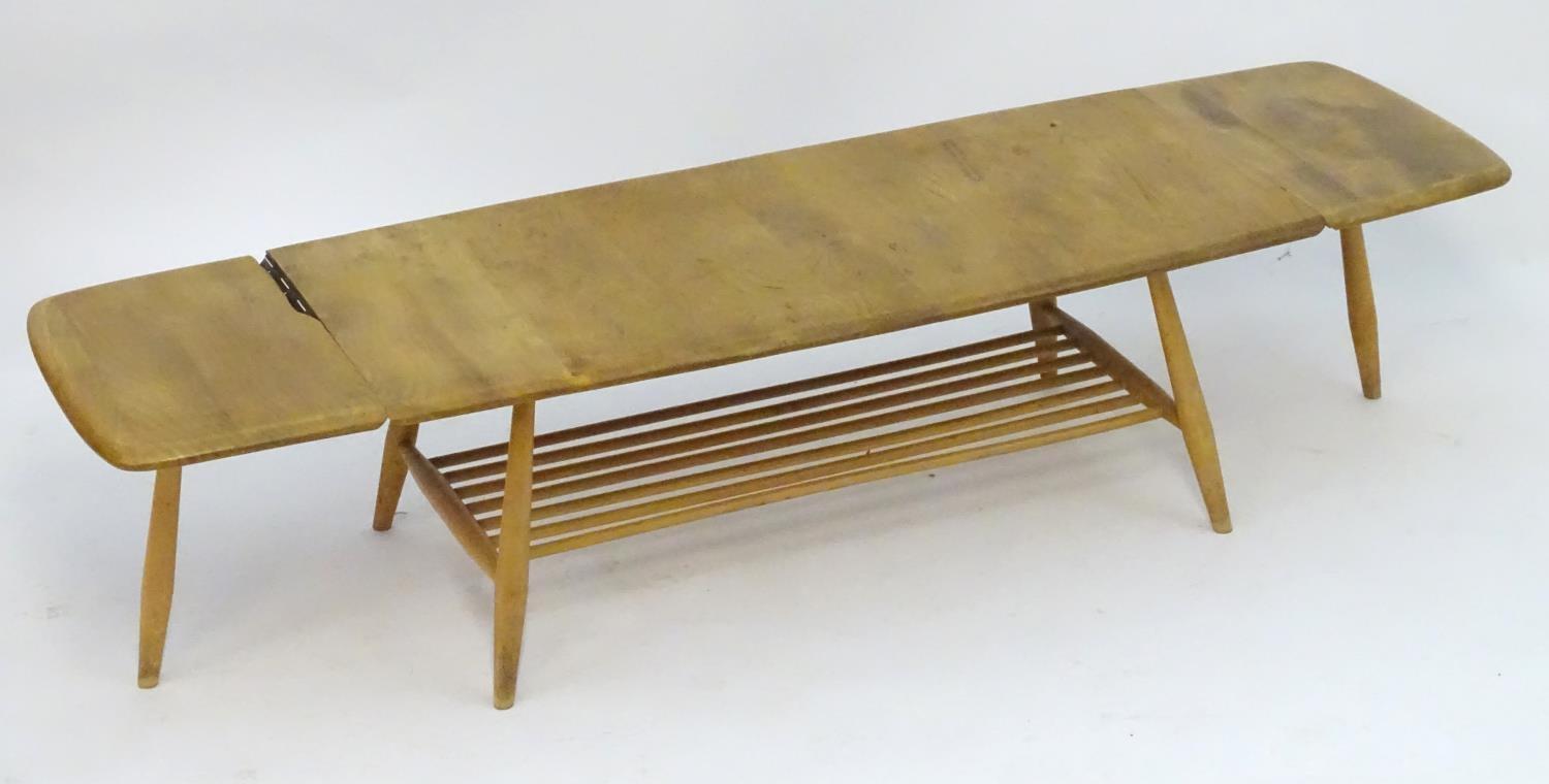 Vintage Retro, Mid-Century: an Ercol elm and beech coffee table, extending with drop flaps, standing - Image 5 of 7