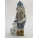 A Lladro figure of a boy with a polar bear cub, model no. 5238. Approx. 5 3/4" high Please Note - we