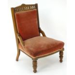 An early 20thC walnut chair with a carved cresting rail, pierced frieze, carved rosettes and an