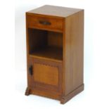 A mid / late 20thC Cotswoold school pot cupboard / bedside cabinet with a single short drawer with