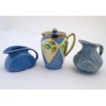 Three assorted English studio pottery jugs, one with a lid, hand painted decoration and lustre